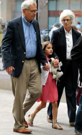 Martin Joseph Holmes Sr. with his granddaughter, Suri, and wife.